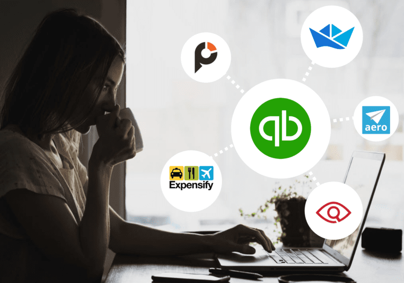 woman sitting at a desk with graphic of quickbooks app logo next to her